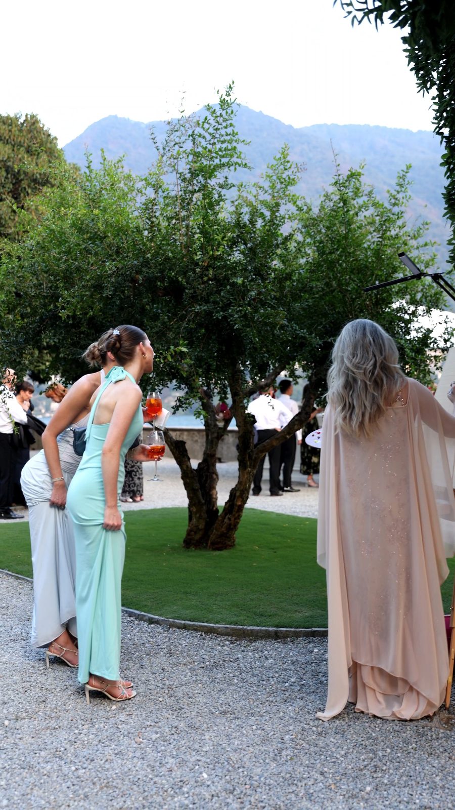 Wedding guests watching the live wedding painting take shape at Villa Pizzo, Lake Como